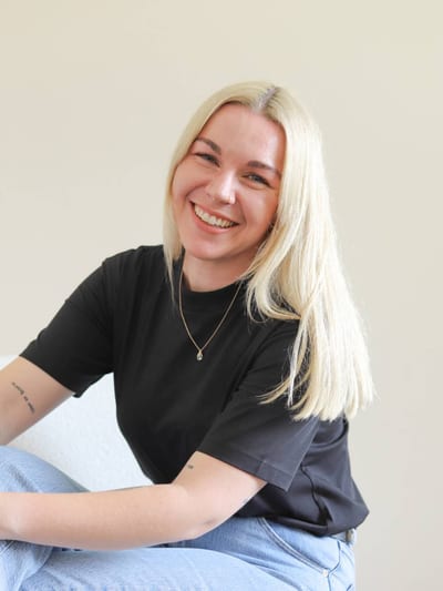 Kristy Gallirhir, clinical psychologist, smiling to camera.